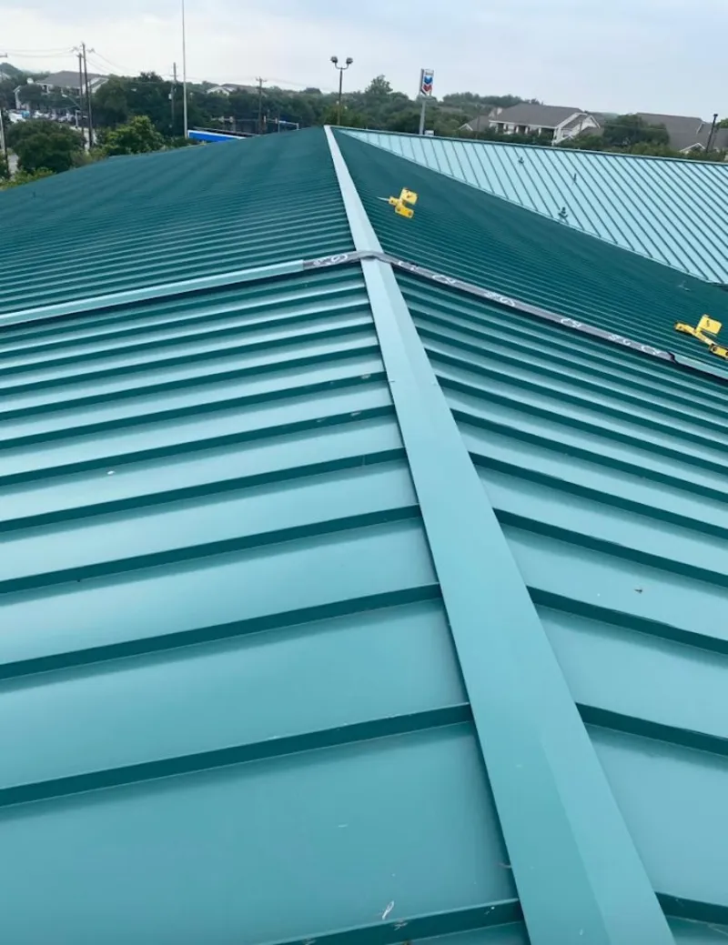Green commercial metal roof ridge and valley for Metal Roof Repair in Palm River-Clair Mel